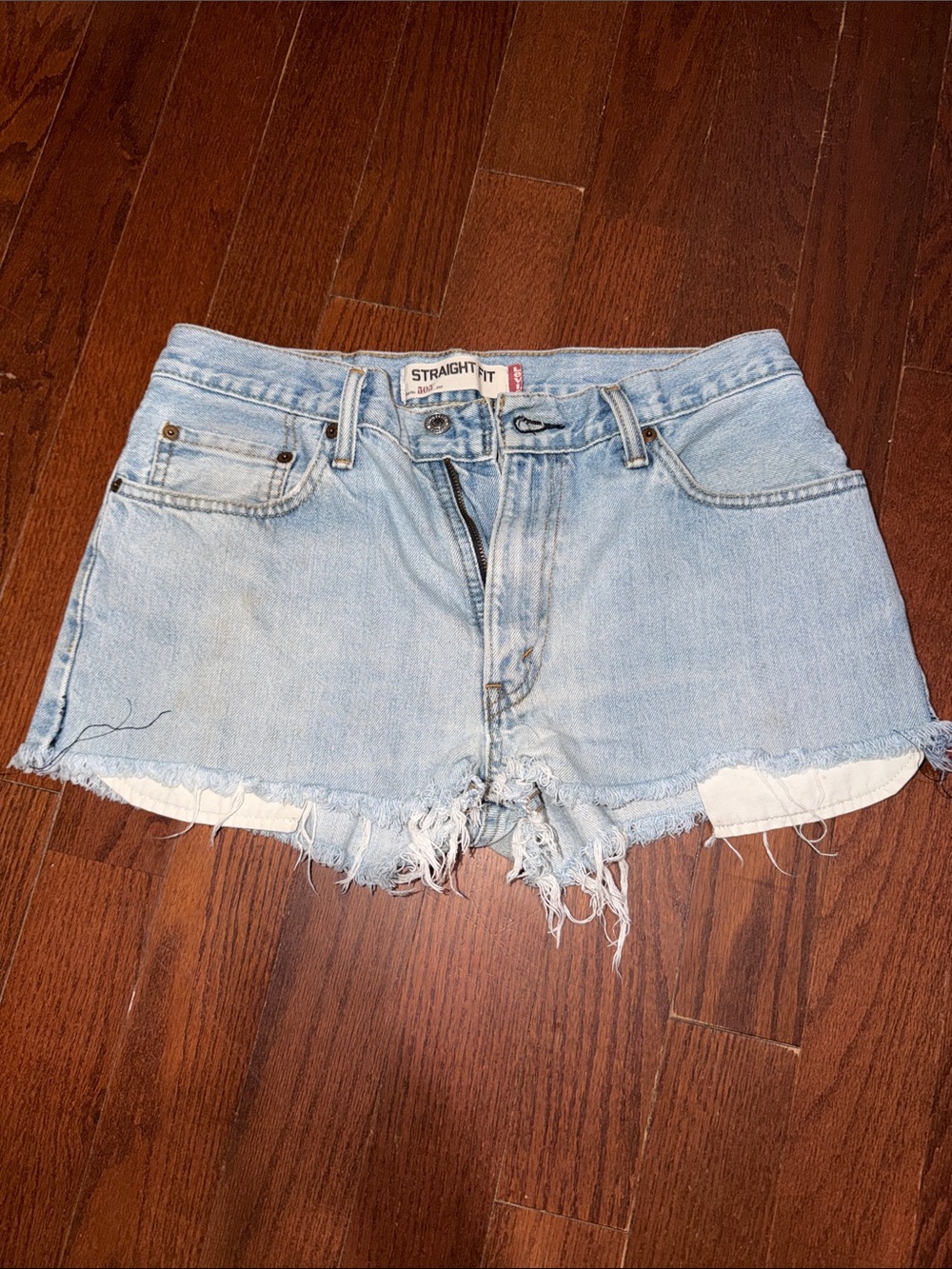 Levi’s 505 Light Blue Distressed Straight Fit Jean Shorts